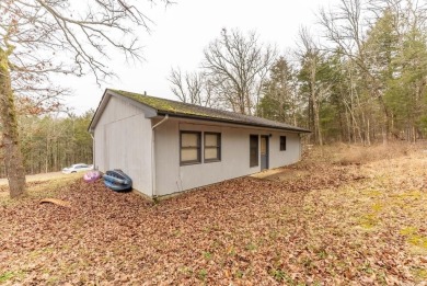 Discover the charm of this 2-bedroom, 1-bath home in the on Cherokee Village North Course in Arkansas - for sale on GolfHomes.com, golf home, golf lot