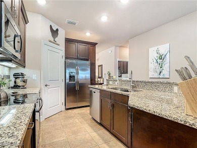 Stunning Custom-Built Lilac Model Home with Saltwater Pool and on Herons Glen Golf and Country Club in Florida - for sale on GolfHomes.com, golf home, golf lot