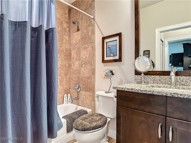 Stunning Custom-Built Lilac Model Home with Saltwater Pool and on Herons Glen Golf and Country Club in Florida - for sale on GolfHomes.com, golf home, golf lot