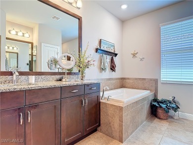Stunning Custom-Built Lilac Model Home with Saltwater Pool and on Herons Glen Golf and Country Club in Florida - for sale on GolfHomes.com, golf home, golf lot