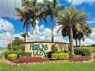 Stunning Custom-Built Lilac Model Home with Saltwater Pool and on Herons Glen Golf and Country Club in Florida - for sale on GolfHomes.com, golf home, golf lot