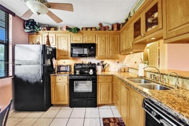 This 2 bedroom 2 bathroom 4th floor Whitehall Condo overlooking on Pine Island Ridge Country Club in Florida - for sale on GolfHomes.com, golf home, golf lot