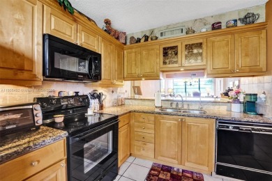 This 2 bedroom 2 bathroom 4th floor Whitehall Condo overlooking on Pine Island Ridge Country Club in Florida - for sale on GolfHomes.com, golf home, golf lot