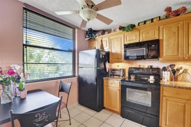 This 2 bedroom 2 bathroom 4th floor Whitehall Condo overlooking on Pine Island Ridge Country Club in Florida - for sale on GolfHomes.com, golf home, golf lot