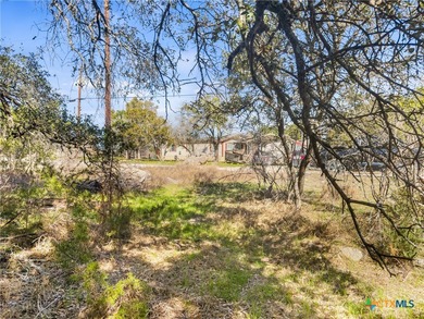Manufactured housing allowed! Very level lot with fantastic oak on Rebecca Creek Golf Club in Texas - for sale on GolfHomes.com, golf home, golf lot