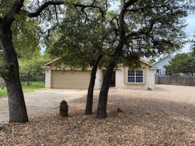 This cozy home is nestled in the trees on a quiet cul-de-sac in on Point Venture Golf Club on Lake Travis in Texas - for sale on GolfHomes.com, golf home, golf lot