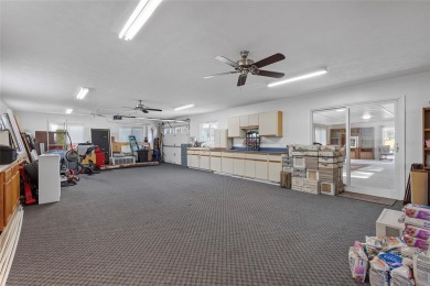 EXCEPTIONAL GARAGE AND WORKSHOP SPACE IDEAL FOR HOBBYISTS OR on The Links of Spruce Creek in Florida - for sale on GolfHomes.com, golf home, golf lot
