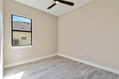 This brand-new, custom-built residence is nestled in the serene on Rotonda Golf and Country Club The Palms Course in Florida - for sale on GolfHomes.com, golf home, golf lot