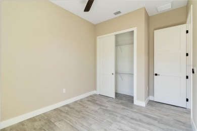 This brand-new, custom-built residence is nestled in the serene on Rotonda Golf and Country Club The Palms Course in Florida - for sale on GolfHomes.com, golf home, golf lot