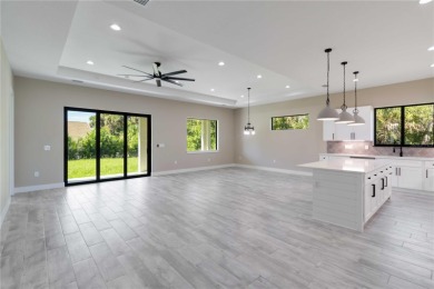 This brand-new, custom-built residence is nestled in the serene on Rotonda Golf and Country Club The Palms Course in Florida - for sale on GolfHomes.com, golf home, golf lot