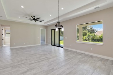 This brand-new, custom-built residence is nestled in the serene on Rotonda Golf and Country Club The Palms Course in Florida - for sale on GolfHomes.com, golf home, golf lot