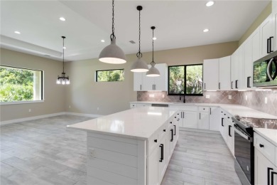 This brand-new, custom-built residence is nestled in the serene on Rotonda Golf and Country Club The Palms Course in Florida - for sale on GolfHomes.com, golf home, golf lot