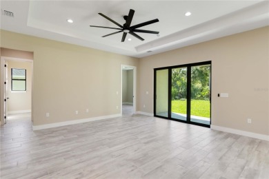 This brand-new, custom-built residence is nestled in the serene on Rotonda Golf and Country Club The Palms Course in Florida - for sale on GolfHomes.com, golf home, golf lot