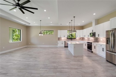 This brand-new, custom-built residence is nestled in the serene on Rotonda Golf and Country Club The Palms Course in Florida - for sale on GolfHomes.com, golf home, golf lot
