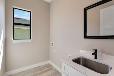 This brand-new, custom-built residence is nestled in the serene on Rotonda Golf and Country Club The Palms Course in Florida - for sale on GolfHomes.com, golf home, golf lot