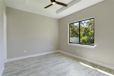 This brand-new, custom-built residence is nestled in the serene on Rotonda Golf and Country Club The Palms Course in Florida - for sale on GolfHomes.com, golf home, golf lot