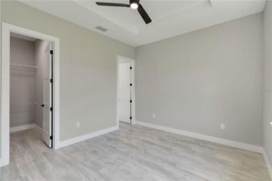 This brand-new, custom-built residence is nestled in the serene on Rotonda Golf and Country Club The Palms Course in Florida - for sale on GolfHomes.com, golf home, golf lot