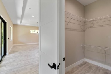 This brand-new, custom-built residence is nestled in the serene on Rotonda Golf and Country Club The Palms Course in Florida - for sale on GolfHomes.com, golf home, golf lot