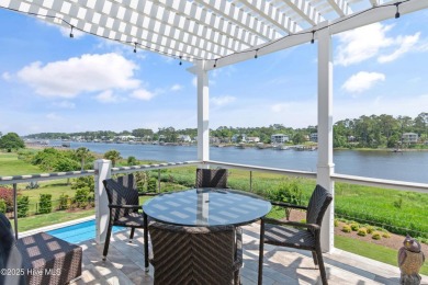 This modern luxury home offers a spectacular waterfront on Members Club At St. James Plantation in North Carolina - for sale on GolfHomes.com, golf home, golf lot