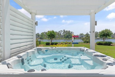 This modern luxury home offers a spectacular waterfront on Members Club At St. James Plantation in North Carolina - for sale on GolfHomes.com, golf home, golf lot