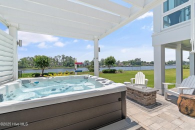This modern luxury home offers a spectacular waterfront on Members Club At St. James Plantation in North Carolina - for sale on GolfHomes.com, golf home, golf lot