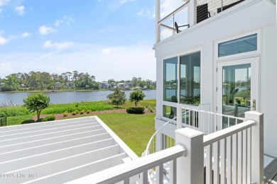 This modern luxury home offers a spectacular waterfront on Members Club At St. James Plantation in North Carolina - for sale on GolfHomes.com, golf home, golf lot