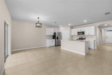 Welcome to this beautifully maintained 4-bedroom, 2-bathroom on Deep Creek Golf Club in Florida - for sale on GolfHomes.com, golf home, golf lot