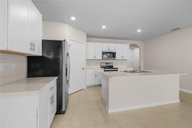 Welcome to this beautifully maintained 4-bedroom, 2-bathroom on Deep Creek Golf Club in Florida - for sale on GolfHomes.com, golf home, golf lot