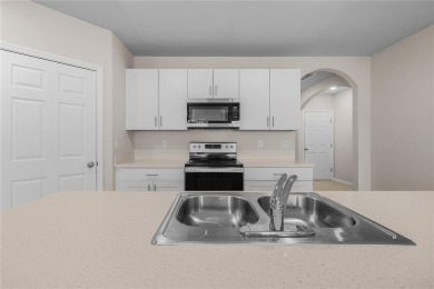 Welcome to this beautifully maintained 4-bedroom, 2-bathroom on Deep Creek Golf Club in Florida - for sale on GolfHomes.com, golf home, golf lot