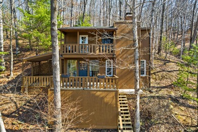 Tucked into a prime hillside setting within Hide-A-Way Hills on Hide-A-Way Hills Golf Club in Ohio - for sale on GolfHomes.com, golf home, golf lot