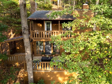 Tucked into a prime hillside setting within Hide-A-Way Hills on Hide-A-Way Hills Golf Club in Ohio - for sale on GolfHomes.com, golf home, golf lot