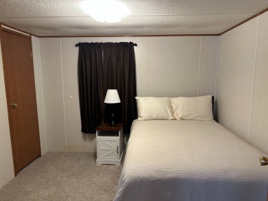 Located on a corner lot in Pine Point, this 2 bedroom, 1.5 bath on Tennessean Golf Club in Tennessee - for sale on GolfHomes.com, golf home, golf lot