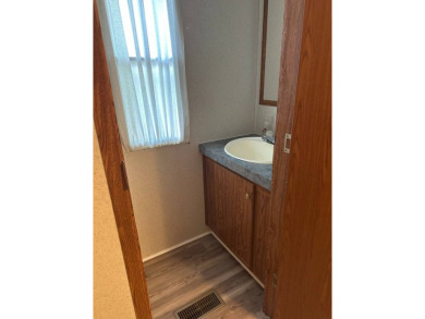 Located on a corner lot in Pine Point, this 2 bedroom, 1.5 bath on Tennessean Golf Club in Tennessee - for sale on GolfHomes.com, golf home, golf lot