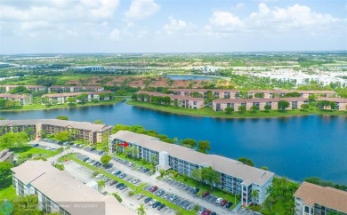 A beautiful lake view 2/2 unit on the top 4th floor located in on Flamingo Lakes Country Club in Florida - for sale on GolfHomes.com, golf home, golf lot