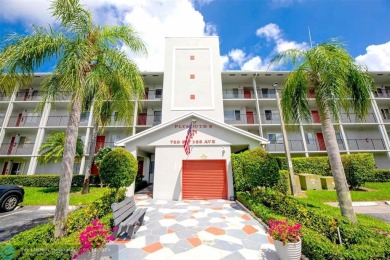 A beautiful lake view 2/2 unit on the top 4th floor located in on Flamingo Lakes Country Club in Florida - for sale on GolfHomes.com, golf home, golf lot