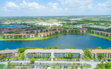 A beautiful lake view 2/2 unit on the top 4th floor located in on Flamingo Lakes Country Club in Florida - for sale on GolfHomes.com, golf home, golf lot