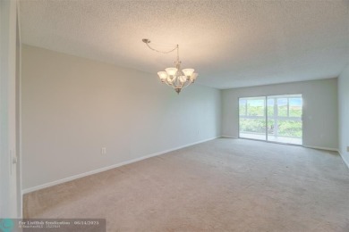A beautiful lake view 2/2 unit on the top 4th floor located in on Flamingo Lakes Country Club in Florida - for sale on GolfHomes.com, golf home, golf lot