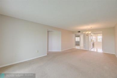 A beautiful lake view 2/2 unit on the top 4th floor located in on Flamingo Lakes Country Club in Florida - for sale on GolfHomes.com, golf home, golf lot