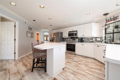 Welcome to your new home in the sought after gated community of on East Lake Woodlands Country Club in Florida - for sale on GolfHomes.com, golf home, golf lot