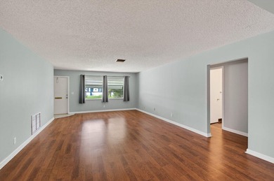 Charming Canal Front 2-Bed, 2-Bath Home with Stunning Upgrades! on Leisureville Community Golf Course in Florida - for sale on GolfHomes.com, golf home, golf lot