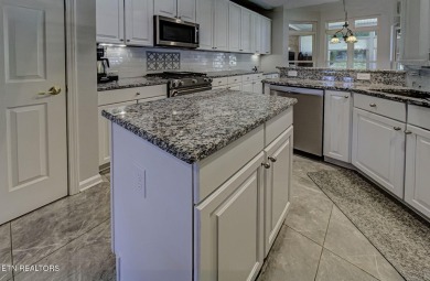 This custom all brick home in the heart of Tellico Village is on Tanasi Golf Course in Tennessee - for sale on GolfHomes.com, golf home, golf lot
