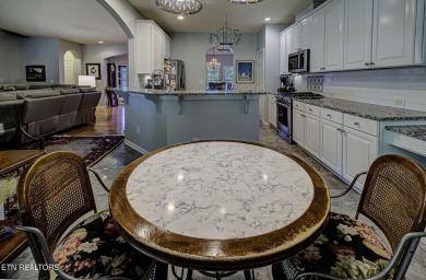 This custom all brick home in the heart of Tellico Village is on Tanasi Golf Course in Tennessee - for sale on GolfHomes.com, golf home, golf lot