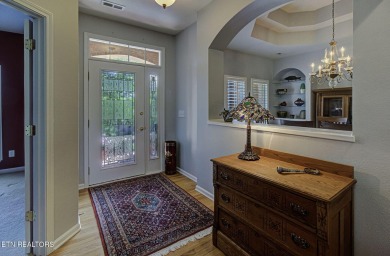 This custom all brick home in the heart of Tellico Village is on Tanasi Golf Course in Tennessee - for sale on GolfHomes.com, golf home, golf lot