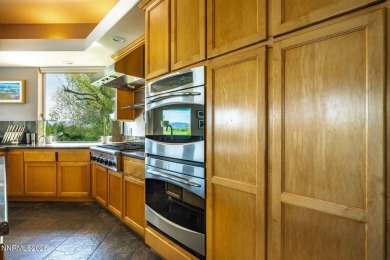 Beautiful single level home located adjacent to the second hole on Genoa Lakes Golf Club - Lakes Course in Nevada - for sale on GolfHomes.com, golf home, golf lot
