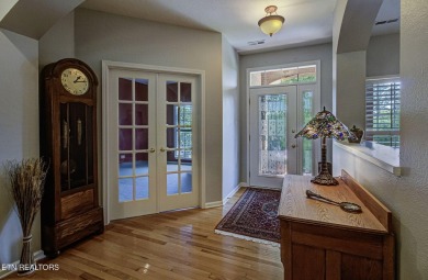 This custom all brick home in the heart of Tellico Village is on Tanasi Golf Course in Tennessee - for sale on GolfHomes.com, golf home, golf lot