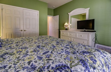 This custom all brick home in the heart of Tellico Village is on Tanasi Golf Course in Tennessee - for sale on GolfHomes.com, golf home, golf lot