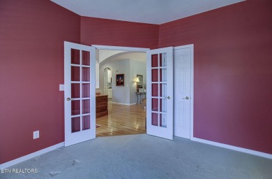 This custom all brick home in the heart of Tellico Village is on Tanasi Golf Course in Tennessee - for sale on GolfHomes.com, golf home, golf lot