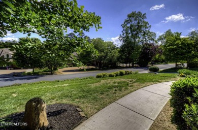 This custom all brick home in the heart of Tellico Village is on Tanasi Golf Course in Tennessee - for sale on GolfHomes.com, golf home, golf lot