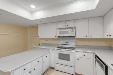 Take in peaceful golf course views from this inviting 2 bedroom on Sugar Mill Country Club in Florida - for sale on GolfHomes.com, golf home, golf lot