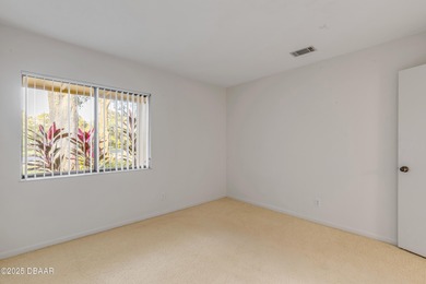 Take in peaceful golf course views from this inviting 2 bedroom on Sugar Mill Country Club in Florida - for sale on GolfHomes.com, golf home, golf lot